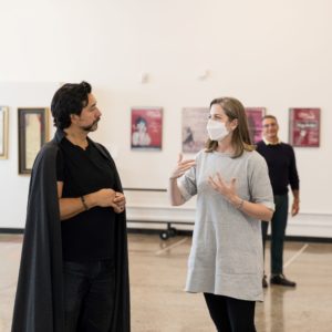 Baritone Luis Ledesma and director Louisa Muller stand in Opera Colorado's rehearsal space talking about the character of Scarpia.