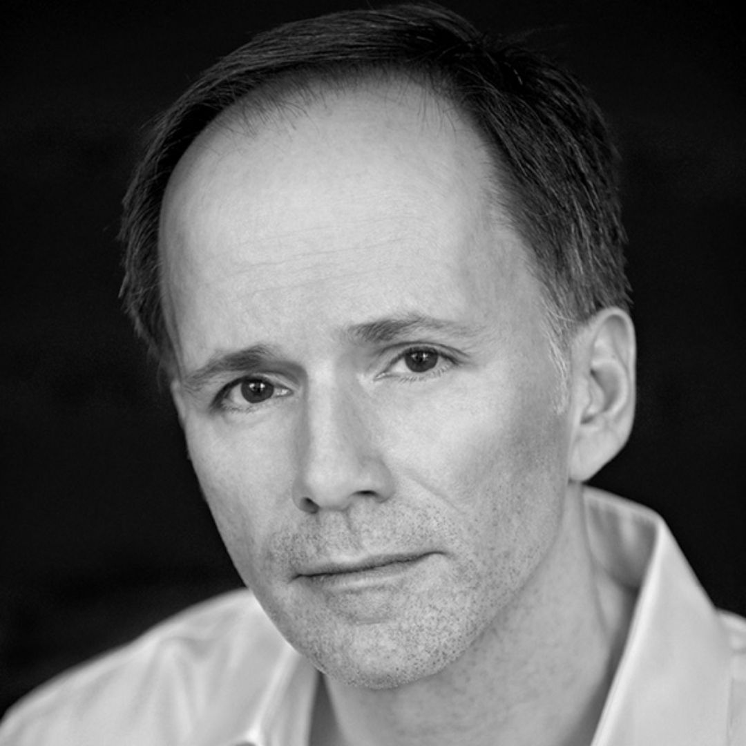 Black and white headshot of a man