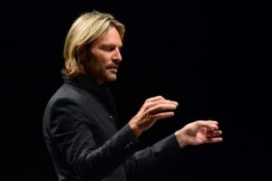 Composer Eric Whitacre conducting