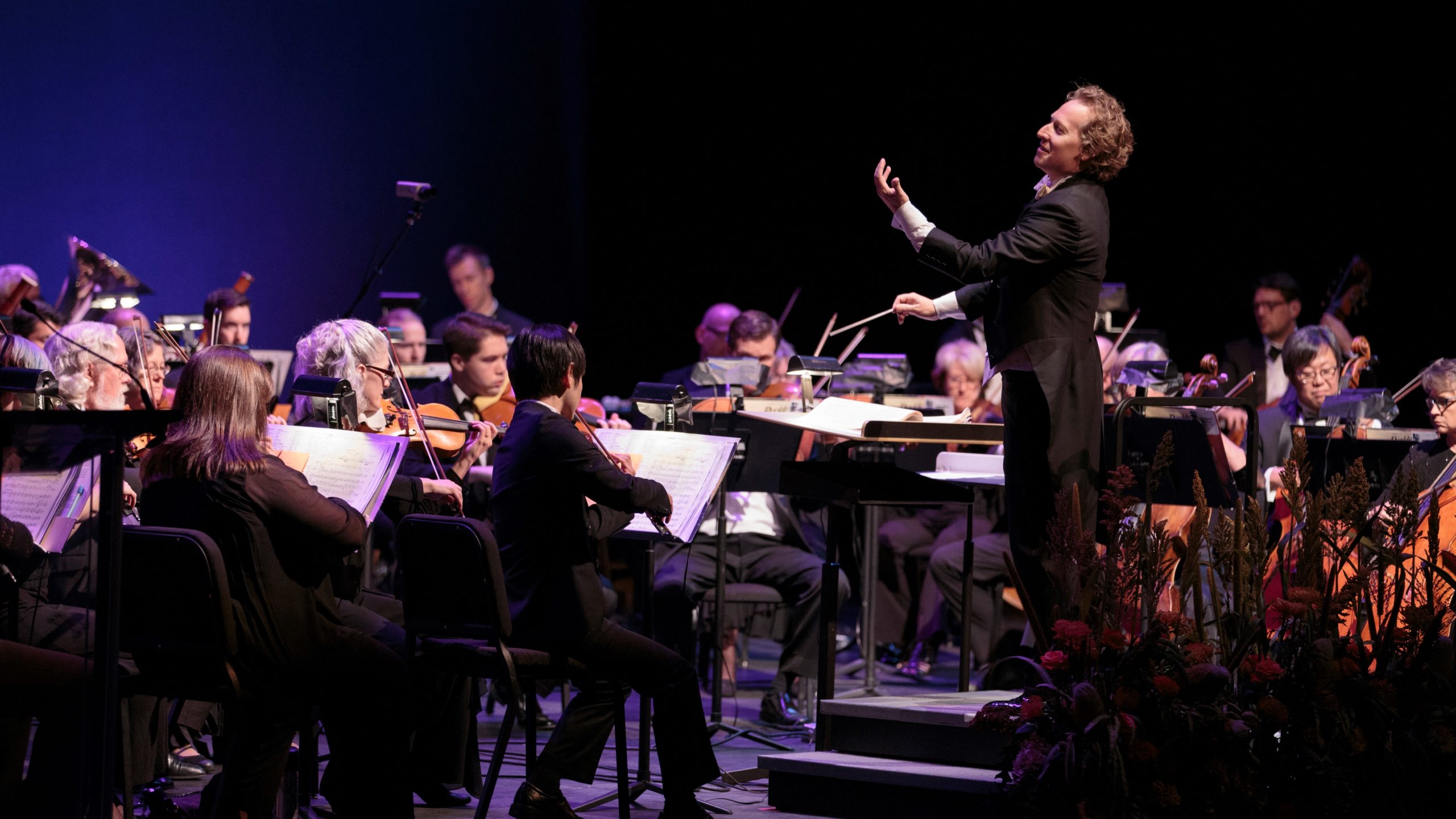 Opera Colorado Music Director Ari Pelto conducts the Opera Colorado Orchestra onstage at the Ellie Caulkins Opera House (2015)