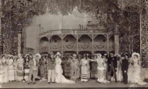 Black and white image of people on stage in 1927