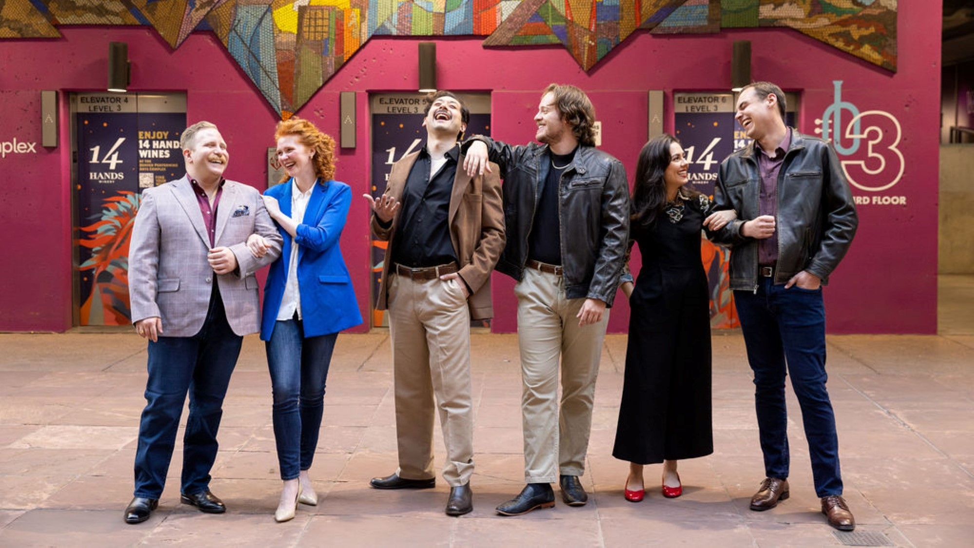 Artists in Residence standing in a line and laughing. Artists, left to right: James Eder, Hallie Schmidt, Oliver Poveda Zavala, Daniel Miller, Melanie Dubil, and Alex Granito.