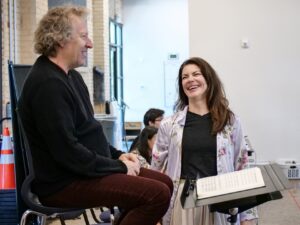 Sara Gartland smiling at Ari Pelto